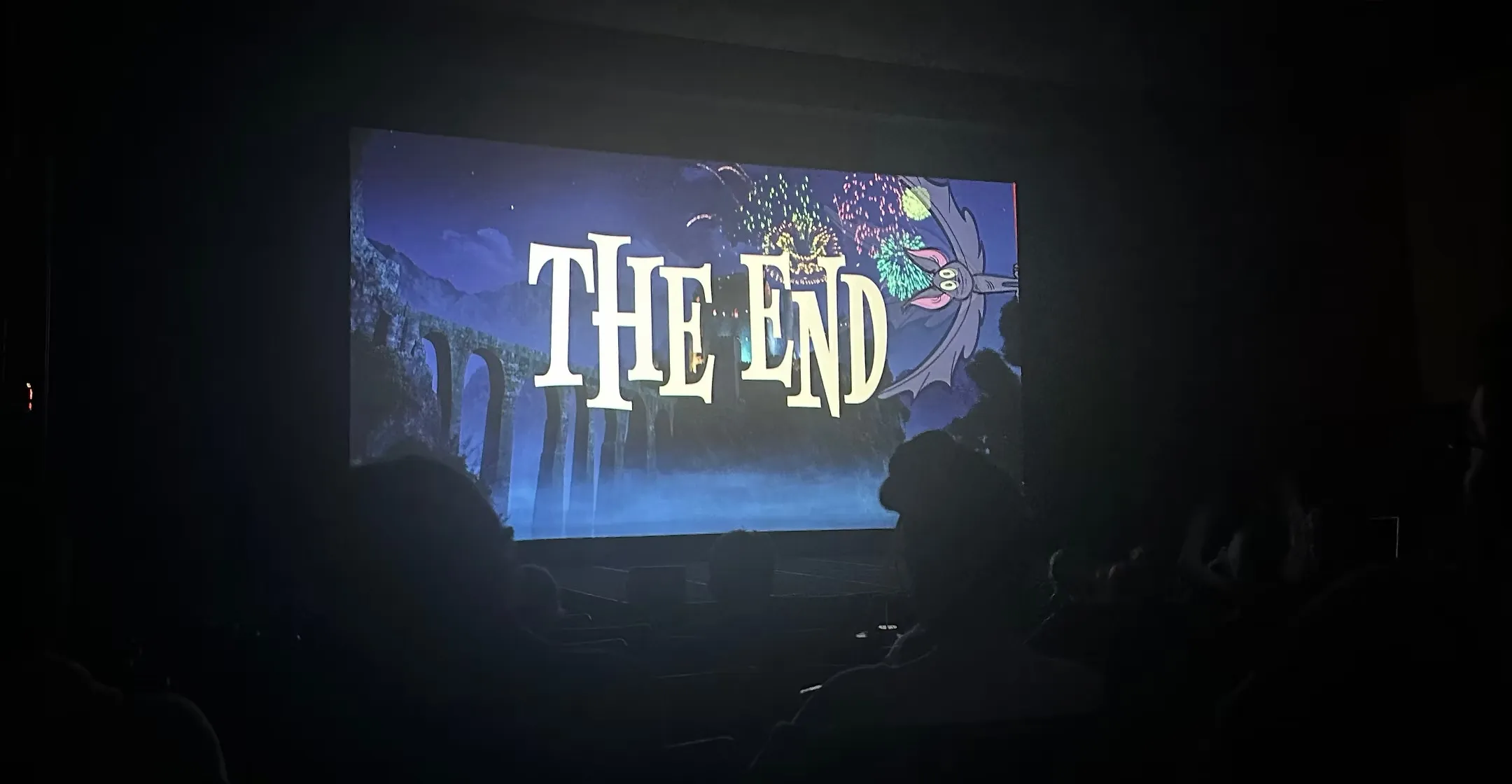 Hotel Transylvania ending screen at the Towne Theater fundraiser, with the audience silhouetted in the foreground.